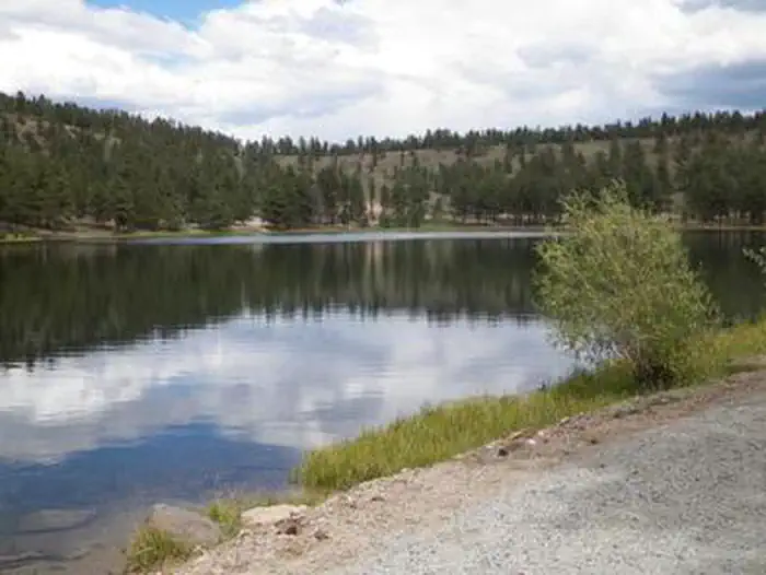 Lake surrounded by hills and trees